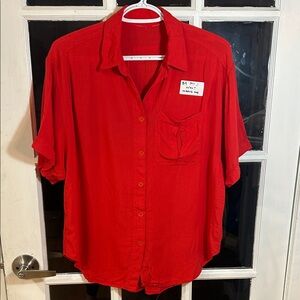 B9.    Vibrant Red Short-Sleeve Button-Up Shirt
